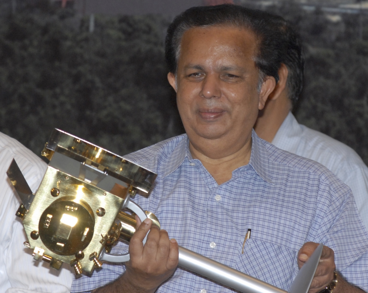 Chairman of the Indian Space Research Organisation (ISRO) G. Madhavan Nair, holds a miniature of India's first unmanned moon mission 'Chandrayaan-1' after its launch from the Satish Dhawan space centre at Sriharikota, about 100 km (62 miles) north of the southern Indian city of Chennai, October 22, 2008. G Madhavan Nair