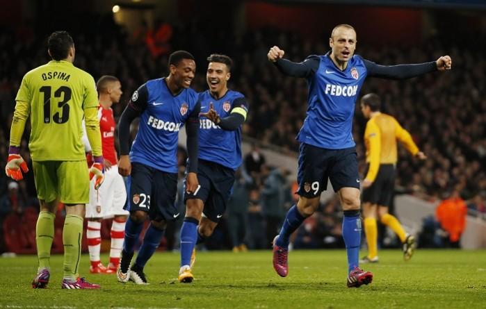 Monaco striker Dimitar Berbatov celebrates after scoring the second goal during his side's clash against Arsenal in the first leg round of sixteen of the Champions League at the Emirates Arsenal vs Monaco