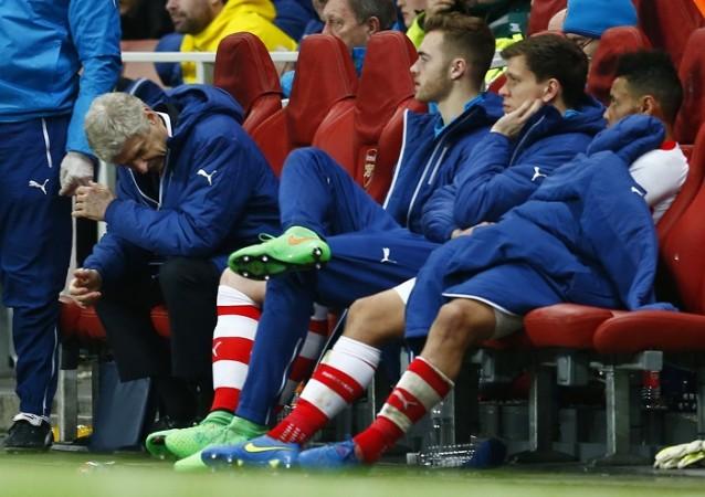 Wenger looks dejected during Arsenal's Champions League clash against Monaco at the Emirates on Tuesday Arsene Wenger