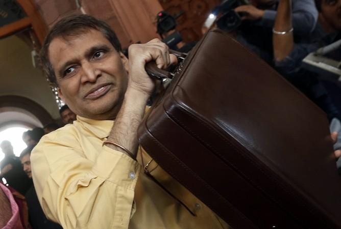 Indian Railway Minister Suresh Prabhu arrives at the parliament to unveil the railway budget in New Delhi February 26, 2015. India's railway budget, to be presented later on Thursday, will signal the direction of long-term reforms needed to revamp the world's fourth-largest rail network, Railway Minister Suresh Prabhu said. Indian Railway Minister Suresh Prabhu