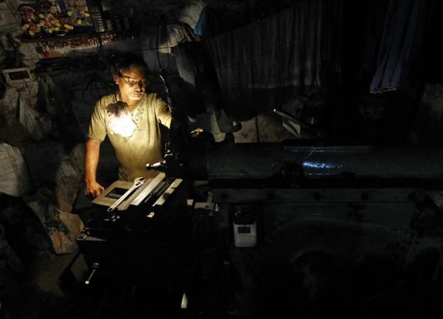 A worker makes gear parts used in hydraulic jacks at a workshop in Kolkata November 27, 2014. Anticipating data out on Friday will show weakening economic growth, India's finance ministry will argue for an interest rate cut, but bankers and company executives say the key to recovery lies in how fast Prime Minister Narendra Modi acts on reforms. Indian Economy