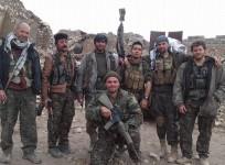 Konstandinos Erik Scurfield (kneeling) along with other foreign fighters in Syria.