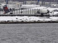 Delta flight 1086 is seen after it slid off the runway upon landing at New York's LaGuardia Airport March 5, 2015.