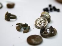 Coins and jewellery from the time of Alexander the Great are displayed in Jerusalem March 9. 2015.