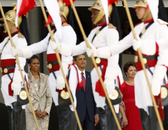 The Obamas & Brazilian President Dilma Vana Rousseff observe the Brazilian honor guard during an arrival ceremony in Brasilia