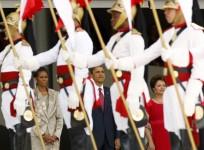 The Obamas & Brazilian President Dilma Vana Rousseff observe the Brazilian honor guard during an arrival ceremony in Brasilia