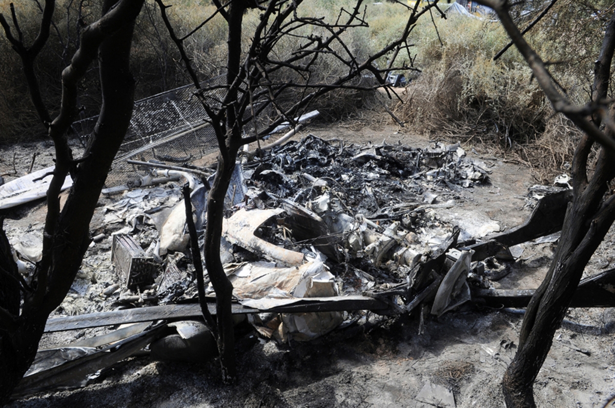 The charred wreckage of the two helicopters which collided is seen in the region of Villa Castelli, in the Argentine province of La Rioja March 10, 2015. Argentina Helicopter Crash