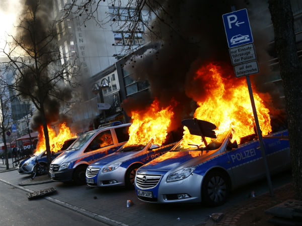 German police cars set on fire