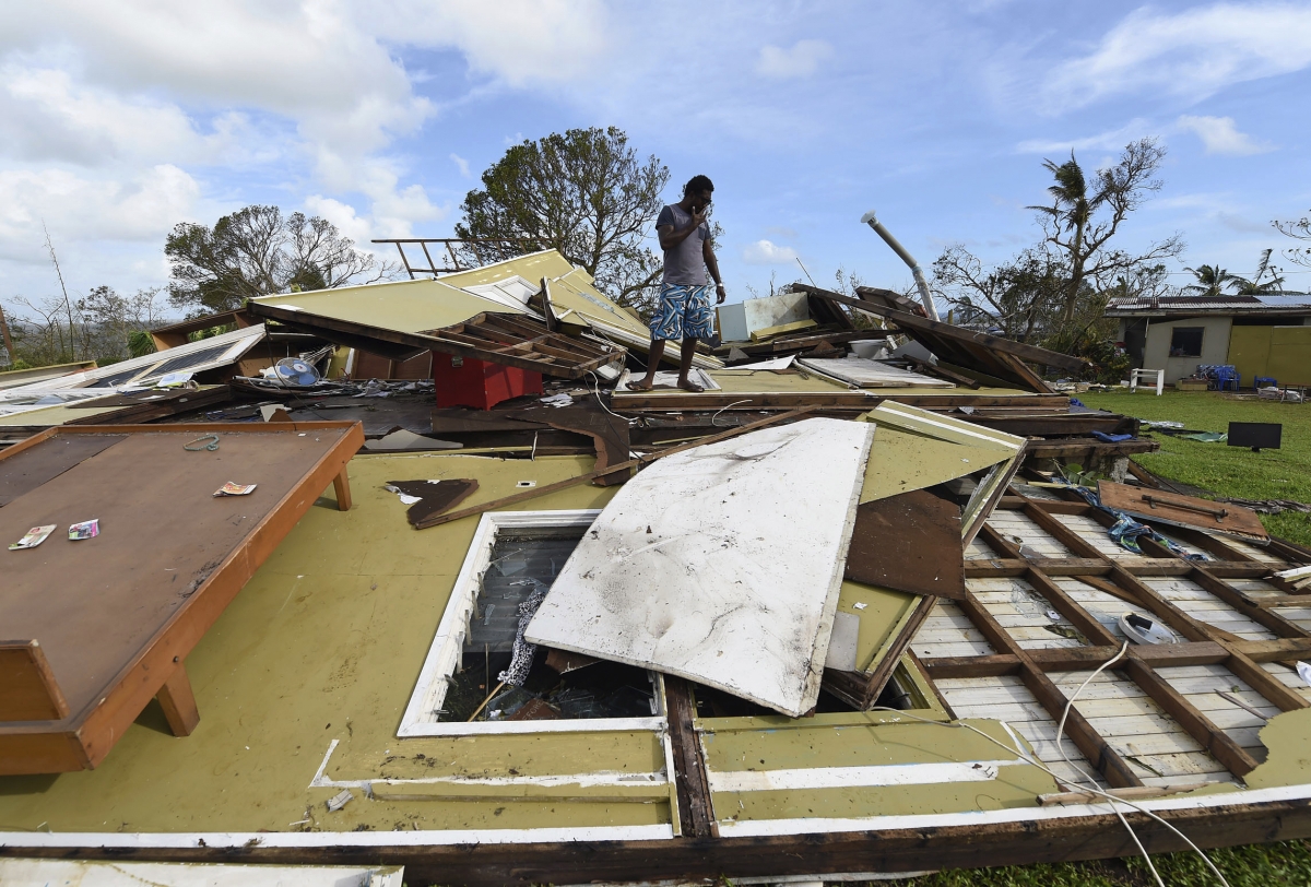 Local resident Adrian Banga looks at his home destroyed by Cyclone Pam in Port Vila, the capital city of the Pacific island nation of Vanuatu March 16, 2015. Vanuatu cyclone Pam