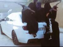 wives and daughters of dead Australian Isis terrorists Suhan Rahman and Mahmoud Abdullatif pose with AK 47 besides a BMW M5.