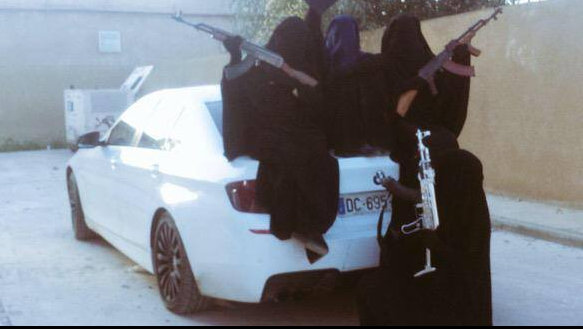 wives and daughters of dead Australian Isis terrorists Suhan Rahman and Mahmoud Abdullatif pose with AK 47 besides a BMW M5. wives and daughters of dead Australian Isis terrorists Suhan Rahman and Mahmoud Abdullatif pose with AK 47 besides a BMW M5.