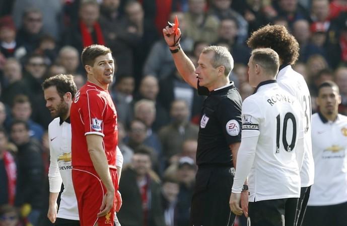 Liverpool's Steven Gerrard is shown a red card by referee Martin Atkinson following his stamp on Manchester United's Ander Herrera Steven Gerrard
