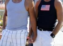 A gay couple hold hands during a rally in support of the United States Supreme Court