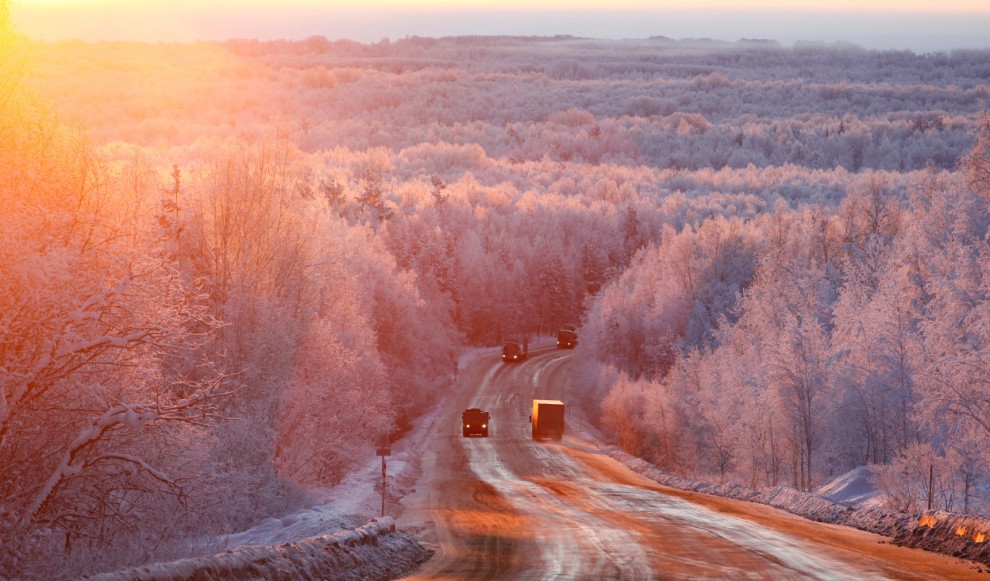 Vehicles drive during sunrise in the Taiga area along the M54 Krasnoyarsk – Mongolia highway, with the air temperature at about – 27 degrees C (-16.6 degrees F), some 120 km (75 mi) south of Russia's Siberian city of Krasnoyarsk, on December 14, 2011. Vehicles drive during sunrise in the Taiga area along the M54 Krasnoyarsk – Mongolia highway, with the air temperature at about – 27 degrees C (-16.6 degrees F), some 120 km (75 mi) south of Russia's Siberian city of Krasnoyarsk, on December 14, 2011.