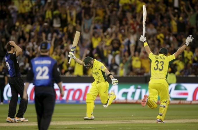 Australia's Steven Smith (C) scores the winning runs to defeat New Zealand as team mate Shane Watson celebrates in their Cricket World Cup final match at the Melbourne Cricket Ground (MCG) Steven Smith