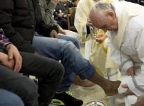 Pope Francis washes the foot of a prisoner at Casal del Marmo youth prison in Rome March 28, 2013