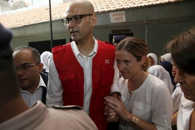 Canadian teacher Neil Bantleman (L) with his wife Tracey