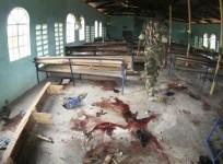 A Kenyan policeman walks inside the African Inland Church after an attack in Kenya's northern town of Garissa July 1, 2012