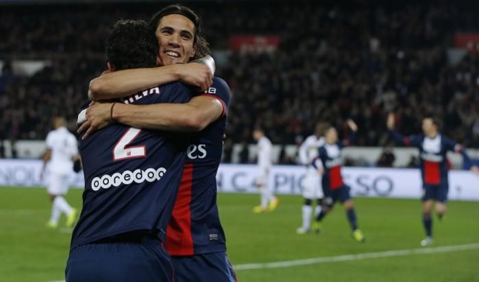 Paris St Germain's Thiago Silva (L) celebrates his goal with team mate Edinson Cavani after scoring against FC Sochaux during their Ligue 1 match at the Parc des Princes Stadium Thiago Silva and Edinson Cavani