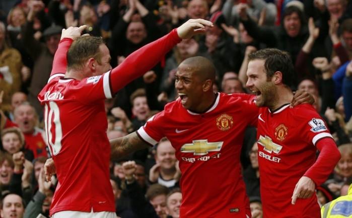 Manchester United players Wayne Rooney, Ashley Young and Juan Mata celebrate a goal against Manchester City in their English Premier League game Wayne Rooney Ashley Young Juan Mata Manchester United