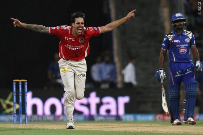 Kings XI Punjab fast bowler Mitchell Johnson celebrates the wicket of Mumbai Indians opener Aaron Finch Mitchell Johnson Kings XI Punjab