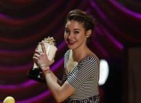 Actress Shailene Woodley accepts the award for Best Kiss for