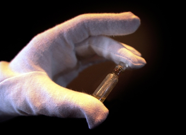 An exhibition displays a vial of perfume rescued from the sunken Titanic. The Titanic Remains