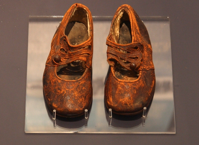 A child's shoes believed to be from the body of an unknown boy and recovered by the crew of the Mackay-Bennett, a cable-laying ship chartered by the White Star Line after the Titanic disaster, are seen in the Maritime Museum of the Atlantic in Halifax. The Titanic Remains