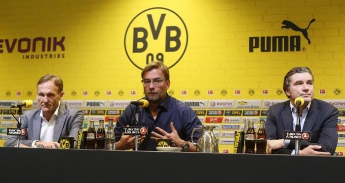Borussia Dortmund's coach Juergen Klopp (C) speaks next to Borussia Dortmund's sports director Michael Zorc (R) and CEO Hans-Joachim Watzke at a news conference. Juergen Klopp