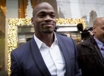 Minnesota Vikings' Adrian Peterson exits following his hearing against the NFL over his punishment