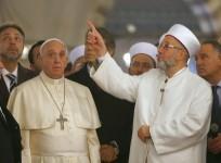 Pope Francis listens to Rahmi Yaran, Mufti of Istanbul (right) during a visit to Hagia Sophia in Istanbul