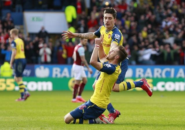 Arsenal midfielder Aaron Ramsey celebrates with teammate Hector Bellerin after scoring the winner against Burnley in their English Premier League game Aaron Ramsey Hector Bellerin Arsenal