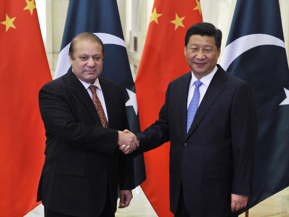Pakistan's Prime Minister Nawaz Sharif shakes hands with China's President Xi Jinping