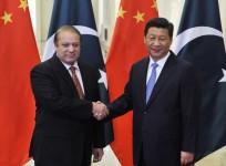 Pakistan's Prime Minister Nawaz Sharif shakes hands with China's President Xi Jinping