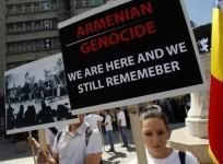 This year marks the 100th anniversary of the Armenian genocide. Above, members of an Armenian community in Romania hold banners in downtown Bucharest April 24, 2012, during a rally observing the anniversary of the beginning of the mass killings of Armenia