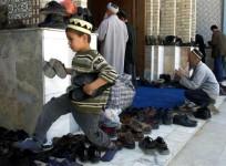 A Tajik boy in a mosque during Friday prayers in Dushanbe October 12, 2001