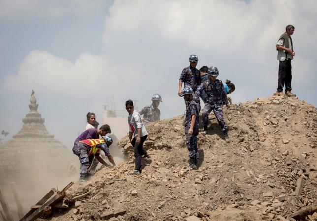 Nepal earthquake: Rescuers pull out woman alive from debris 50 hours after quake