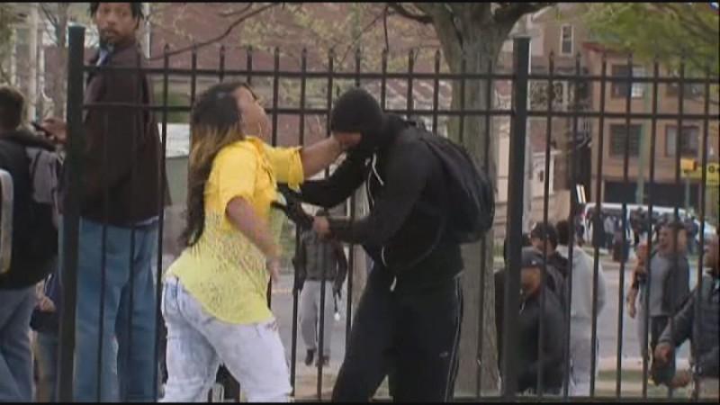 Baltimore mother hailed 'mother of the year' after she catches masked son rioting after Freddie Gray funeral.