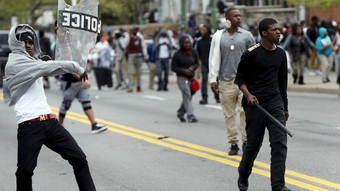 Demonstrators throw rocks at Baltimore police during clashes in Baltimore, Maryland April 27, 2015.