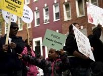 Demonstrators gather in front of Baltimore Police Department Western District in Baltimore, Maryland, April 25, 2015