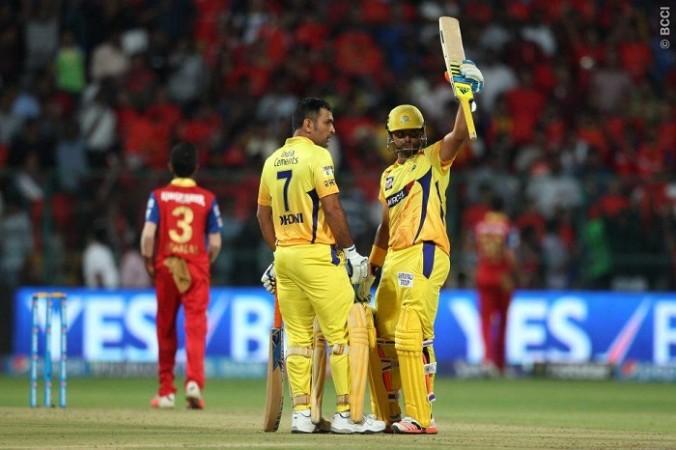 CSK batsman Suresh Raina acknowledges the crowd after completing his half-century as skipper MS Dhoni looks on in the IPL 2015 match against RCB Suresh Raina MS Dhoni CSK RCB