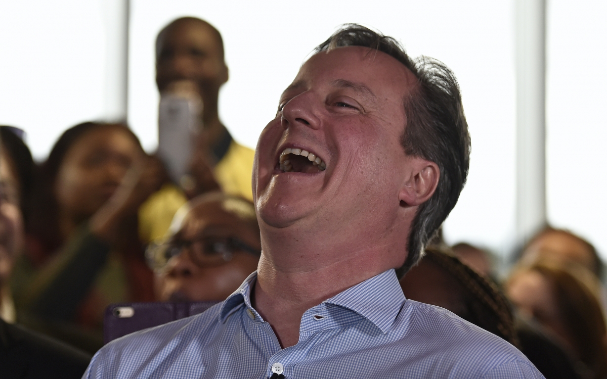 Britain's Prime Minister David Cameron laughs as London Mayor Boris Johnson speaks during an election rally in Hendon in north London, Britain May 5, 2015. Britain will go to the polls in a national election on May 7. Uk election