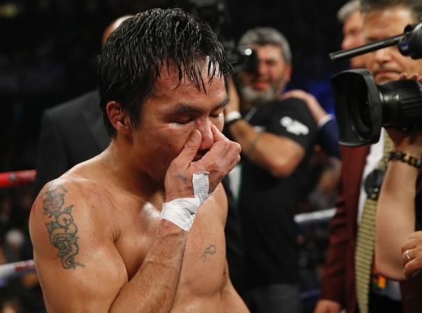 Manny Pacquiao reacts after his loss to Floyd Mayweather Manny Pacquiao Mayweather