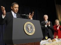 President Obama (L-R) is applauded by Vice President Biden and Secretary of State Hillary Rodham Clinton during the National Prayer Breakfast at a Washington hotel Feb. 4, 2010.