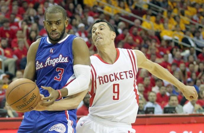 Chris Paul (in blue) scored 22 points in game 5 against the Houston Rockets. Chris Paul