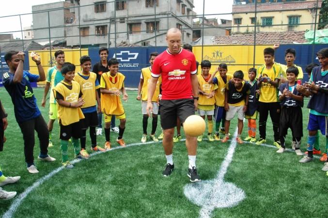 Mikael Silvestre with the kids during an inauguration of the football pitch in Kolkata. Mikael Silvestre
