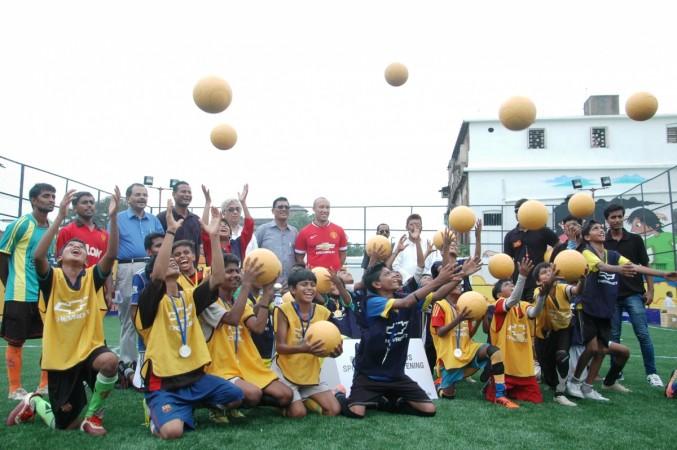 Mikael Silvestre with the kids during an inauguration of the football pitch in Kolkata. Mikael Silvestre