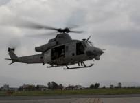 A UH-1Y Huey helicopter flies into the Tribhuvan International Airport after a search and rescue operation in Kathmandu, Nepal, May 13, 2015.