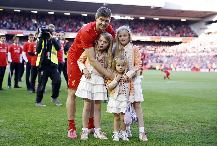 Liverpool's Steven Gerrard poses on the pitch with his family after his final game at Anfield Steven Gerrard's farewell