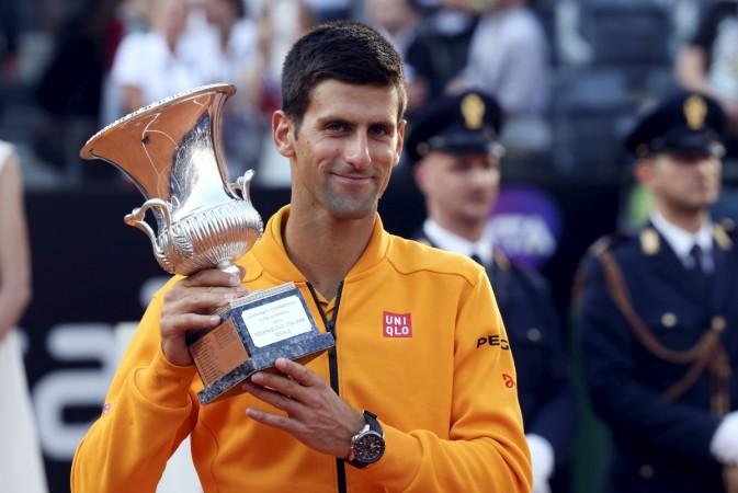 Novak Djokovic with the 2015 Rome Masters title after defeating Roger Federer in the finals. Novak Djokovic